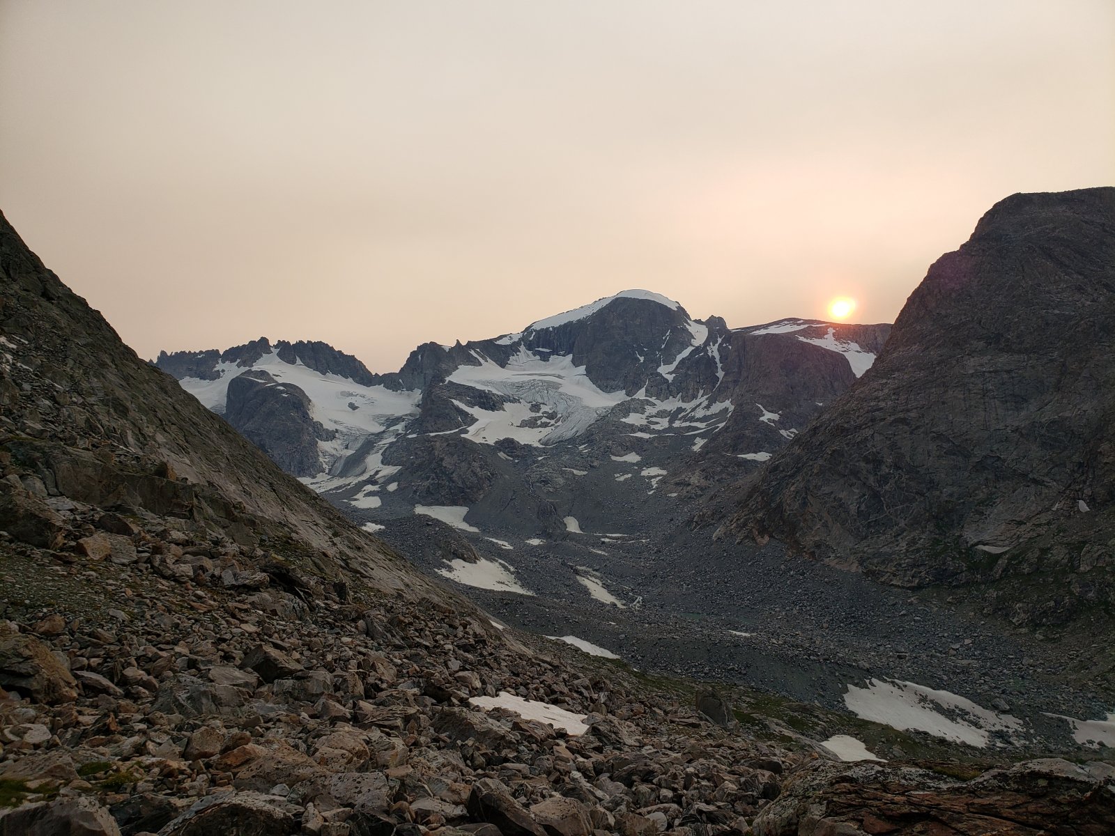 The sun setting over Gannett with no clouds, but plenty of smoky haze...