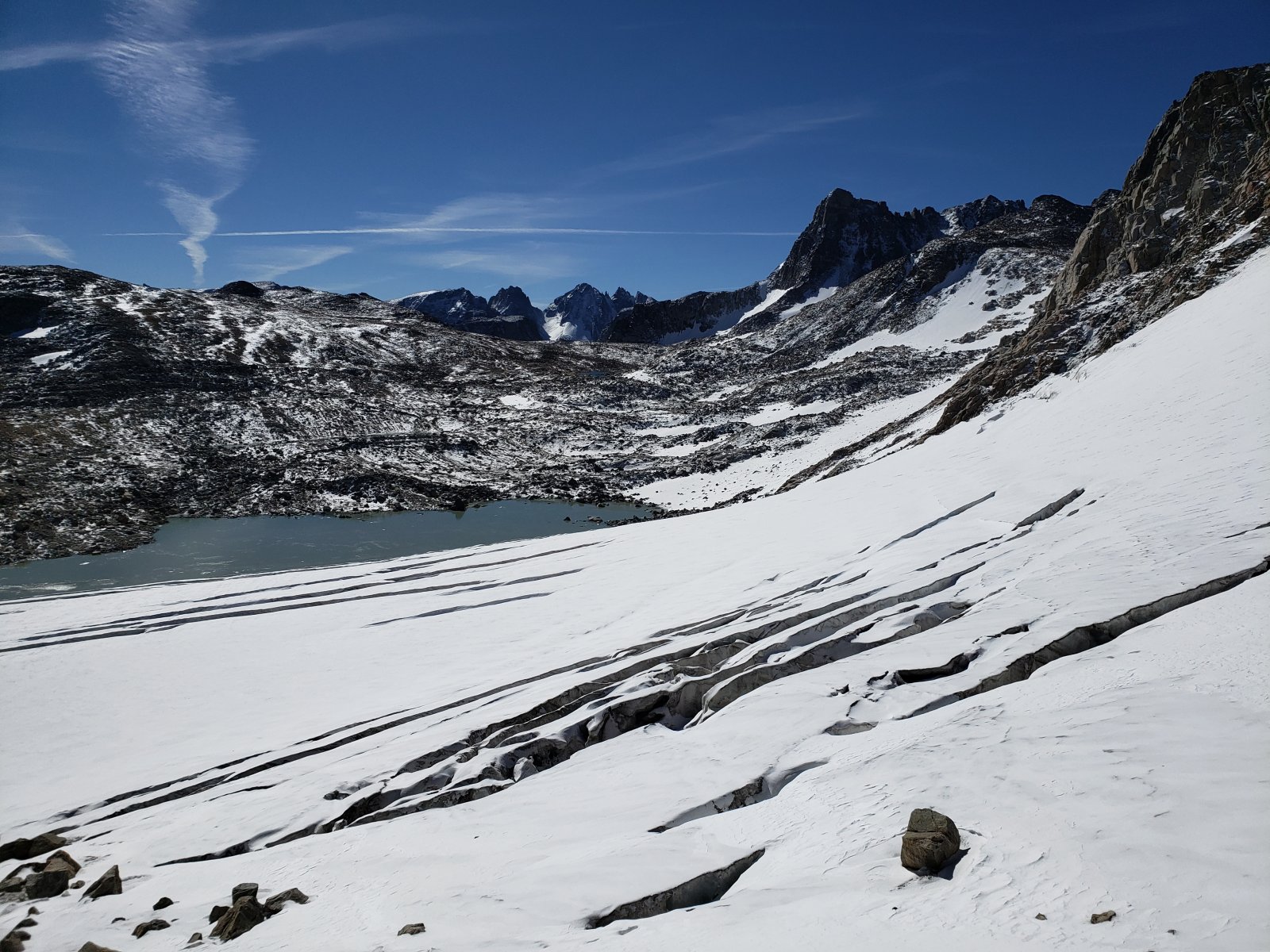 Crevasses on the descent to the foot of Grasshopper Glacier w/ Gannett Peak and West Sentinel Pass in the distance.