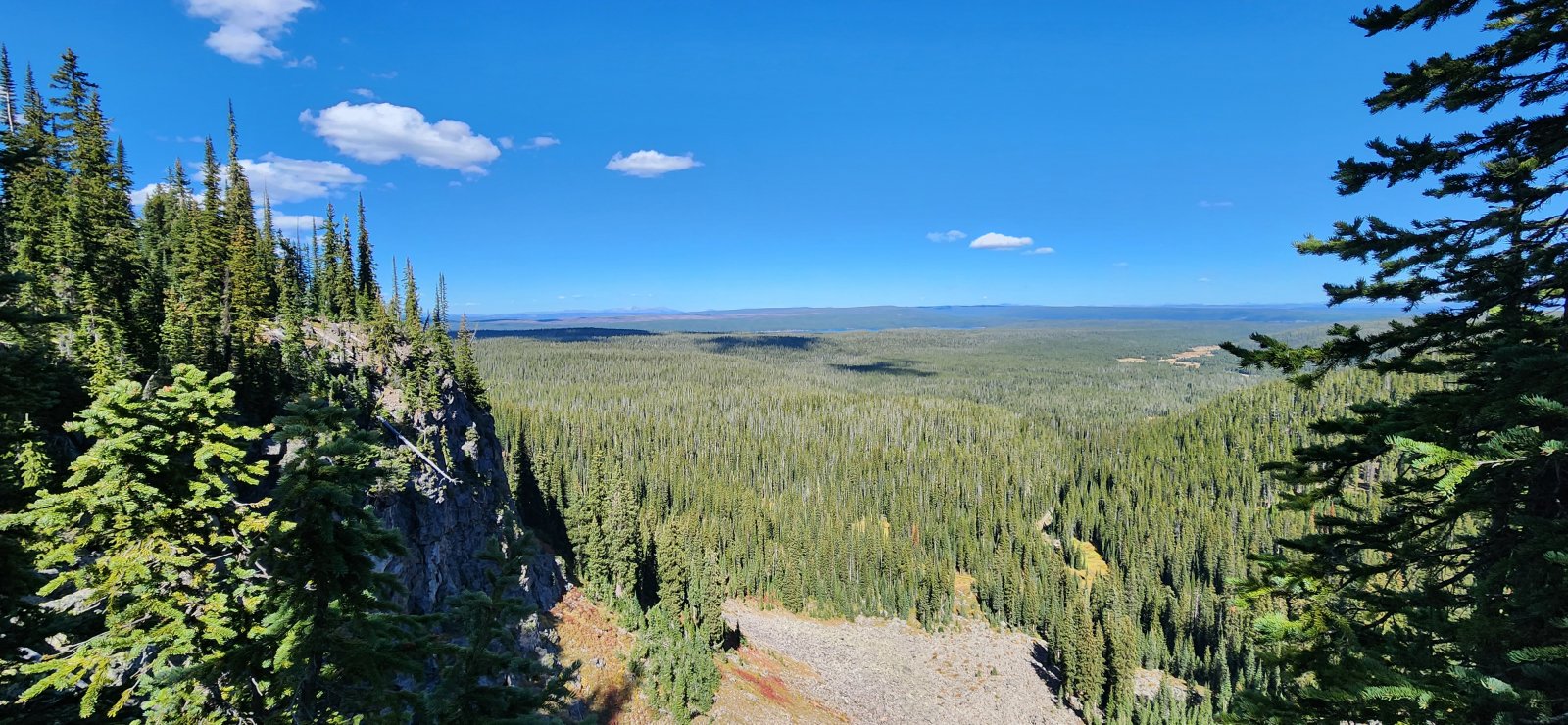 Eventually the stream dropped right off the plateau - a pretty 
spectacular view. And our first look at Shoshone Lake where we'd be 
spending the night.