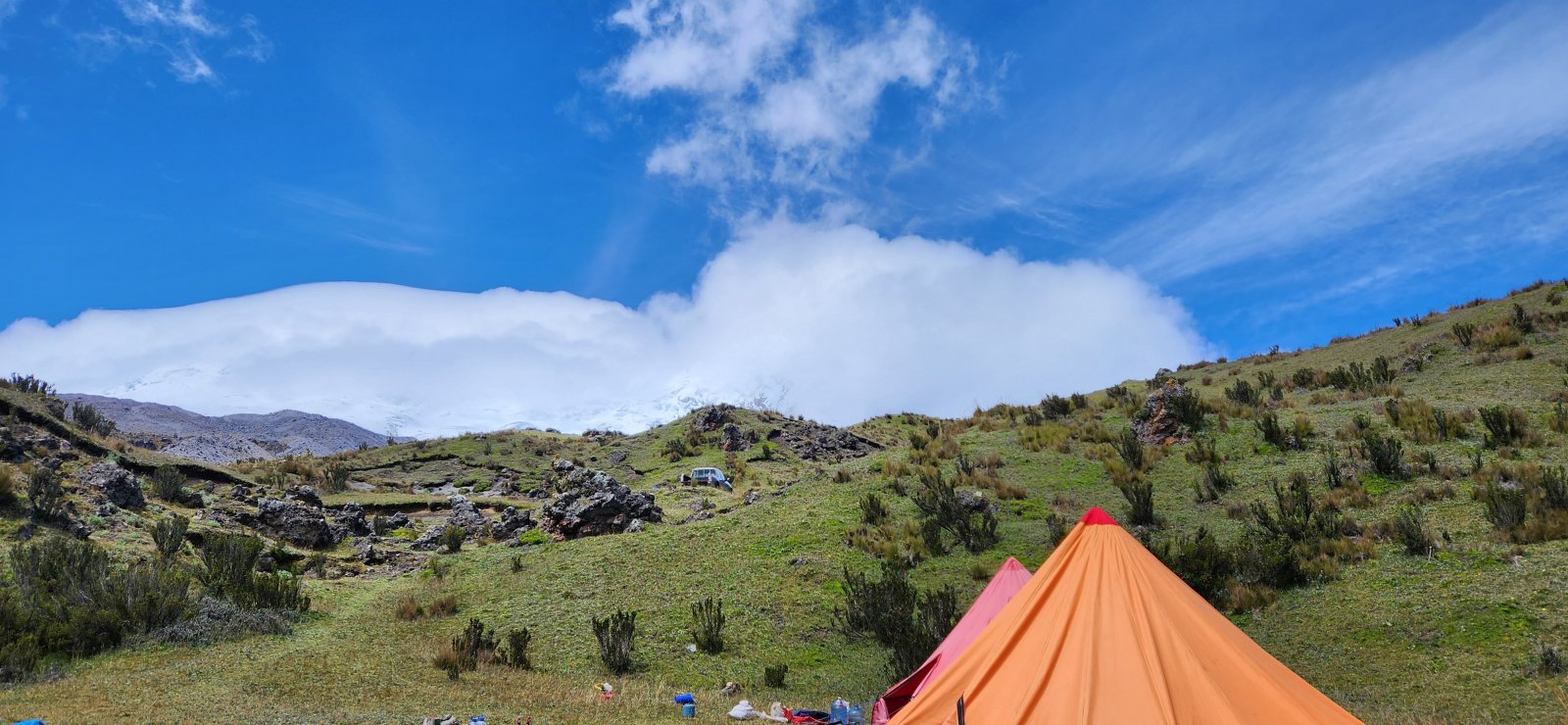 Antisana barely peaking out above base camp the afternoon before our climb.