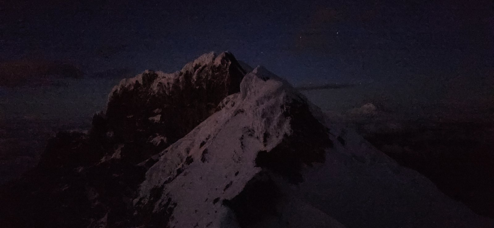 My camera (phone) isn't great in the dark, but an early look at Antisana's large subpeak as we passed by around 5a.