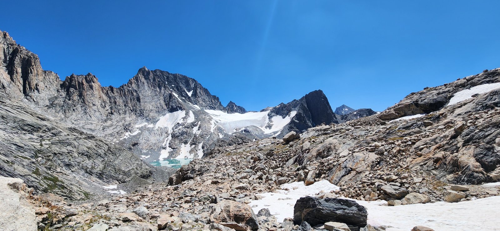 The lake in the distance does not appear on topographic maps and was 
revealed by recession of Minor Glacier. (So I guess we can call it Minor
 Lake?)