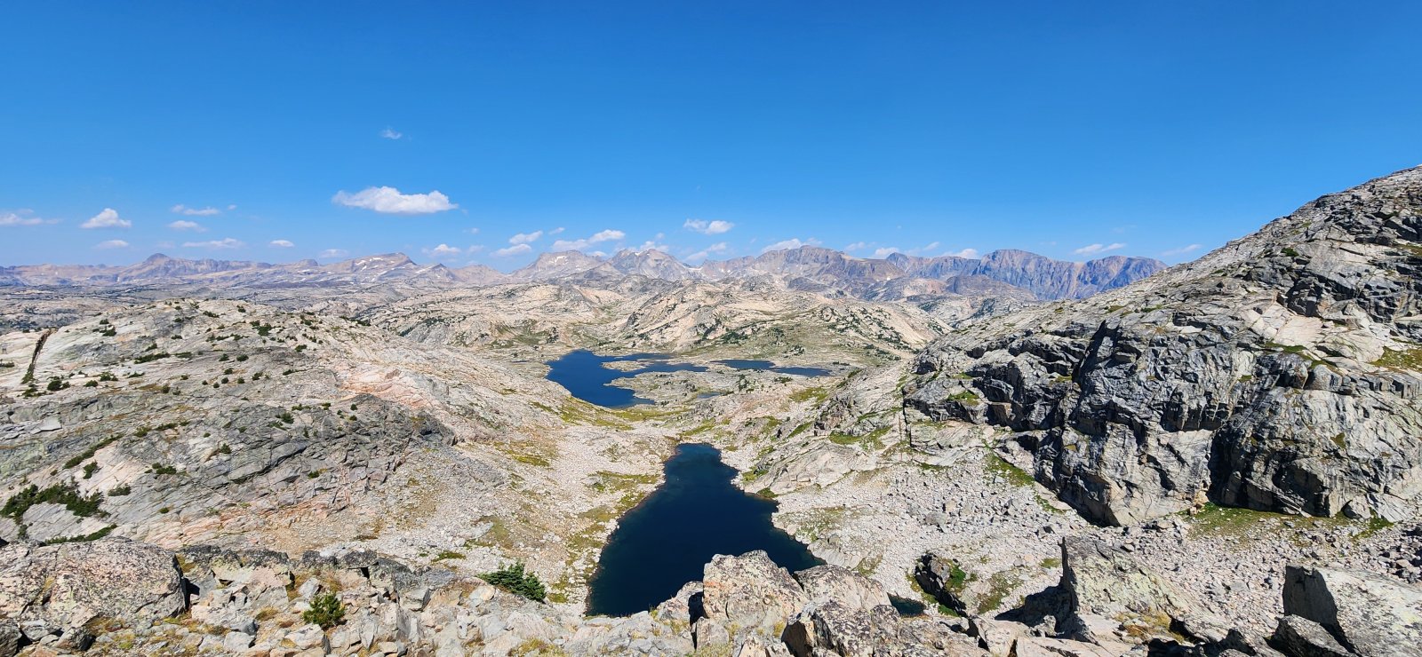 A beautiful unnamed lake (in which @RyanP took a swim) in the foreground and Fossil Lake in the distance.