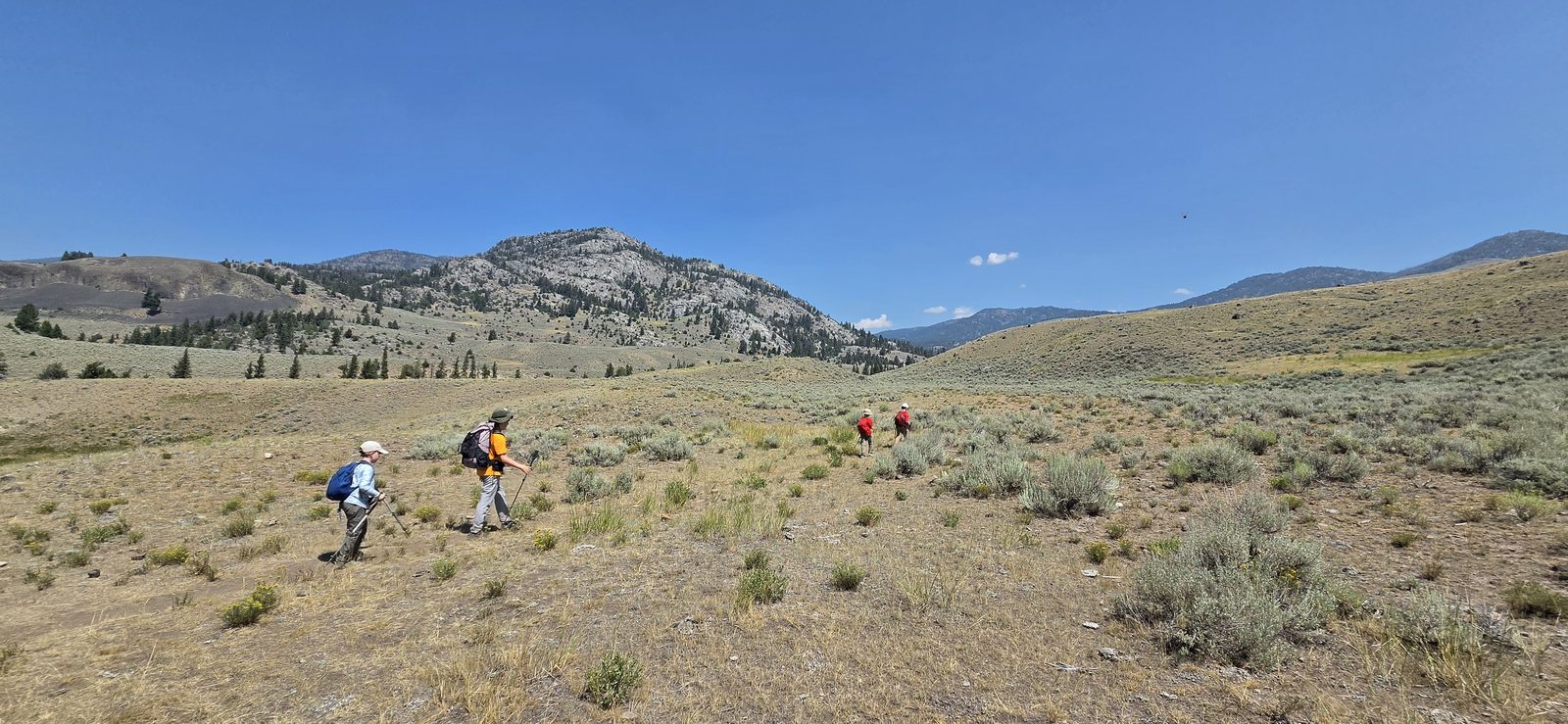 As expected, it was a hot one - but we'd soon find the trees and Hellroaring Creek. (Also, my oldest is now wearing my old Zpacks bag... and it fits. 😢)